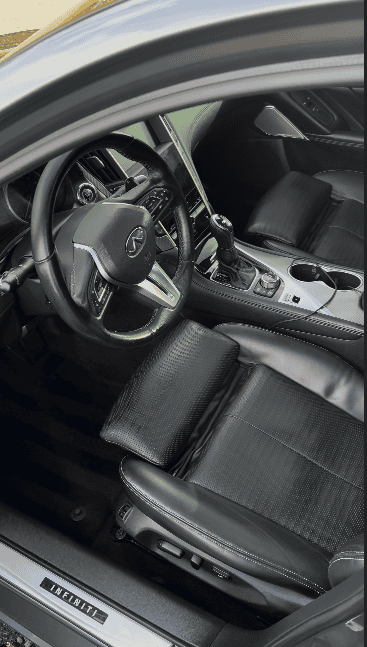 Clean black Infiniti interior after detailing